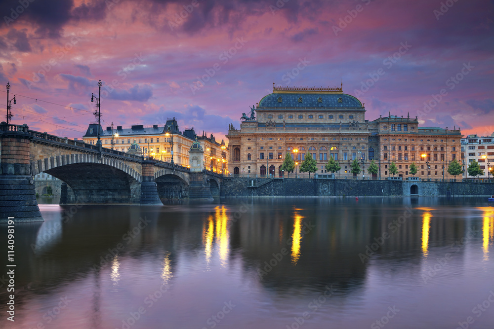 Prague. Image of Prague riverside with reflection of the city in Vltava River and National Theatre.