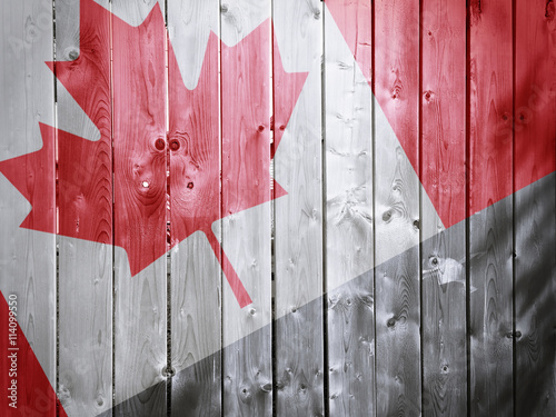 canadian flag on wood textu...