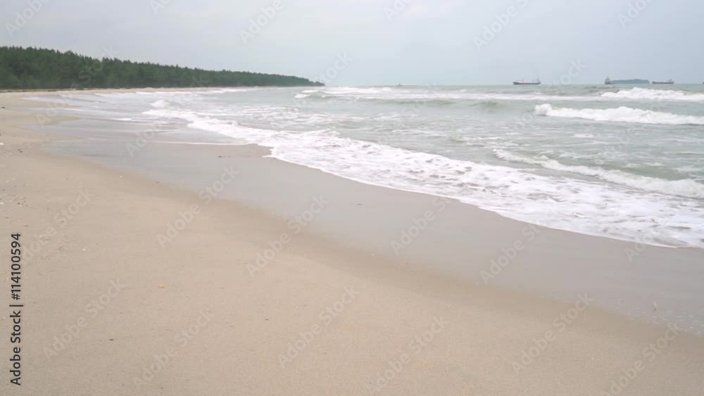 Surf and distant ships. Slow motion video shot on cloudy day Surf and distant ships. Slow motion video shot on cloudy day