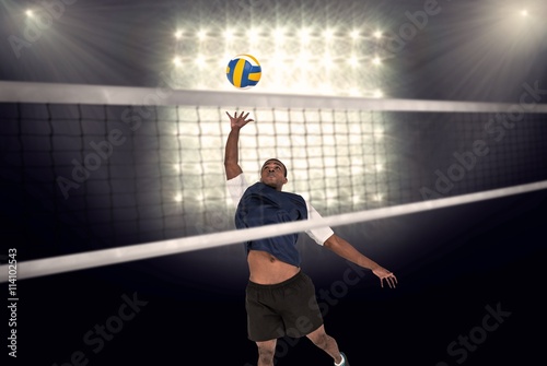 Composite image of sportsman playing volleyball