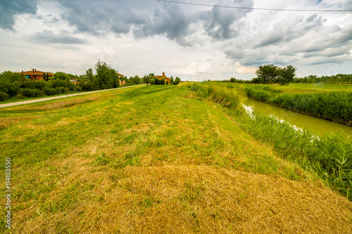 river running near eighteenth century church in bucolic landscap