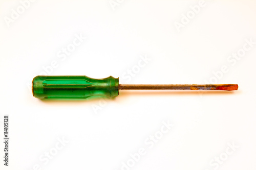 old rusty screwdriver on a white background