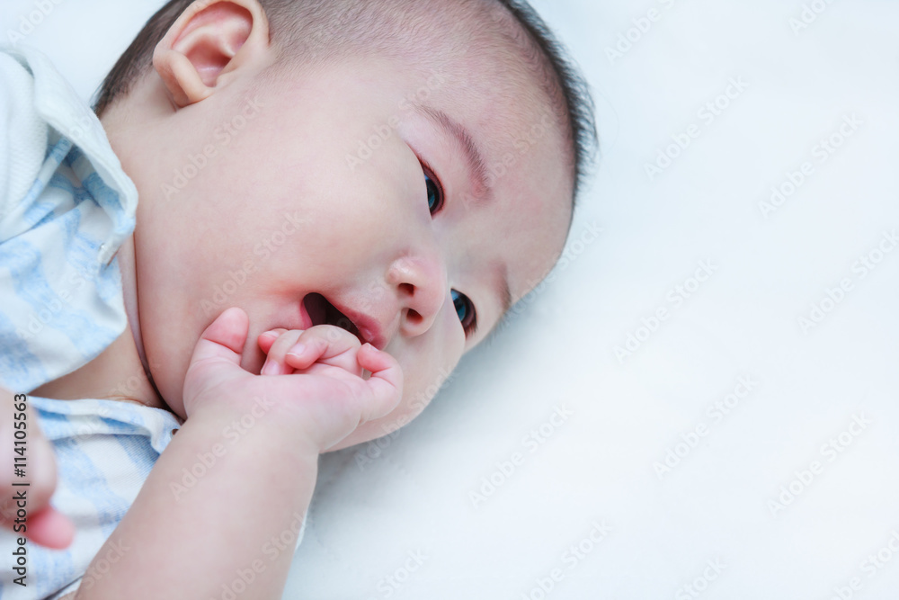 Closeup happy smiling child lying in bed. Adorable baby girl. Closeup happy smiling child lying in bed. Adorable baby girl.