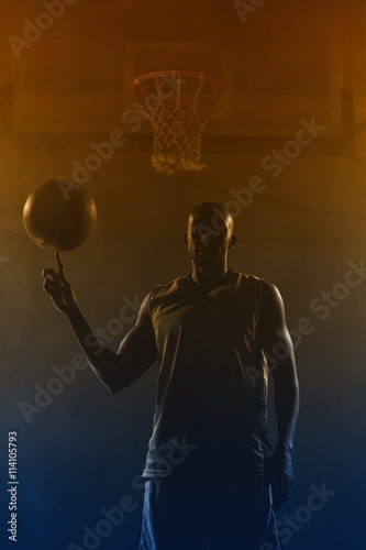 Basketball player turning the ball on his finger  © vectorfusionart