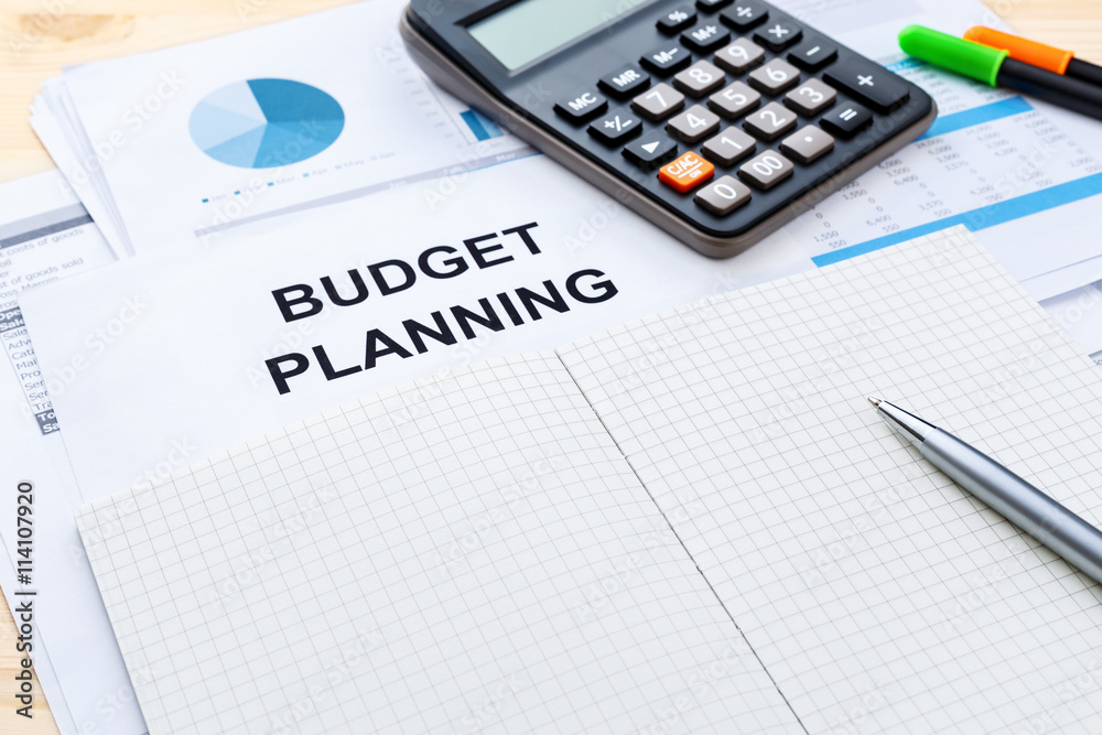 Budget planning with blank notebook Budget planning with blank notebook