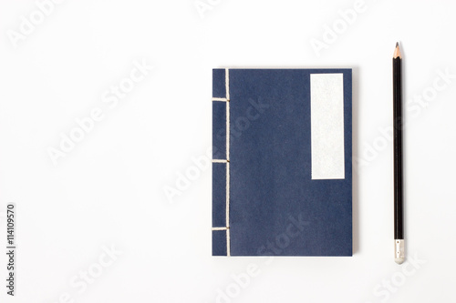 vintage notebook with pencil