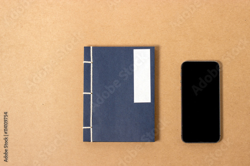 vintage notebook and smartphone