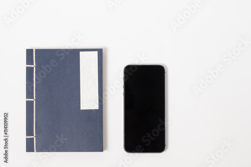 vintage notebook and smartphone
