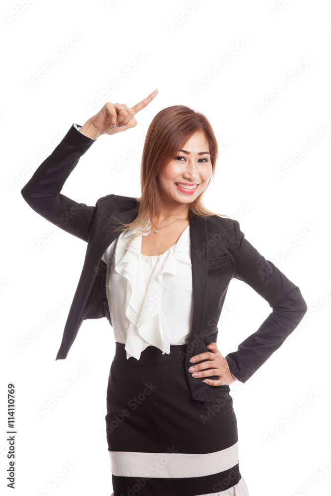 Young Asian businesswoman smile and point up Young Asian businesswoman smile and point up