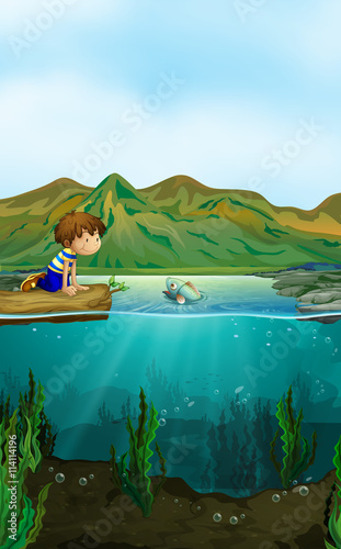 Nature scene with boy and fish