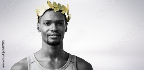 Portrait of victorious sportsman with crown of laurels 