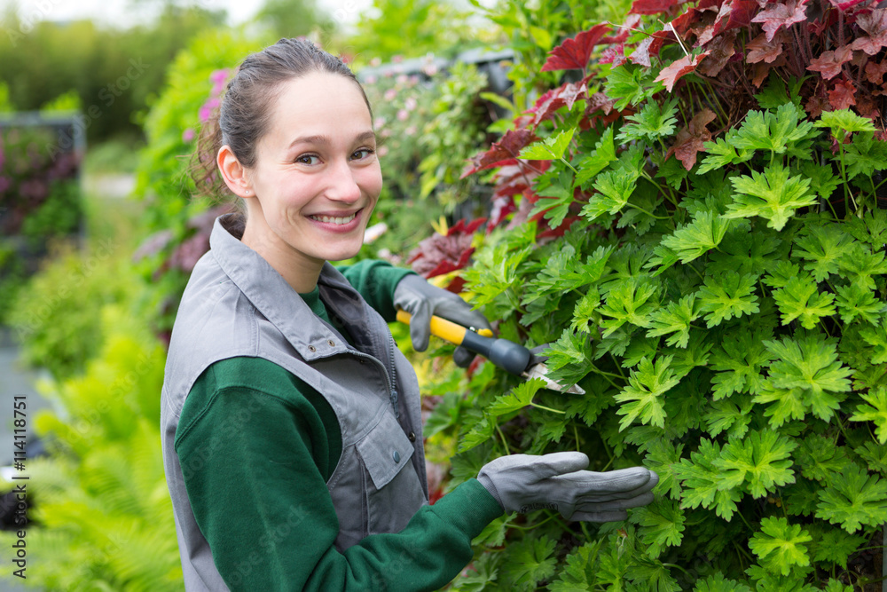 Young attractive woman working in a public garden Young attractive woman working in a public garden