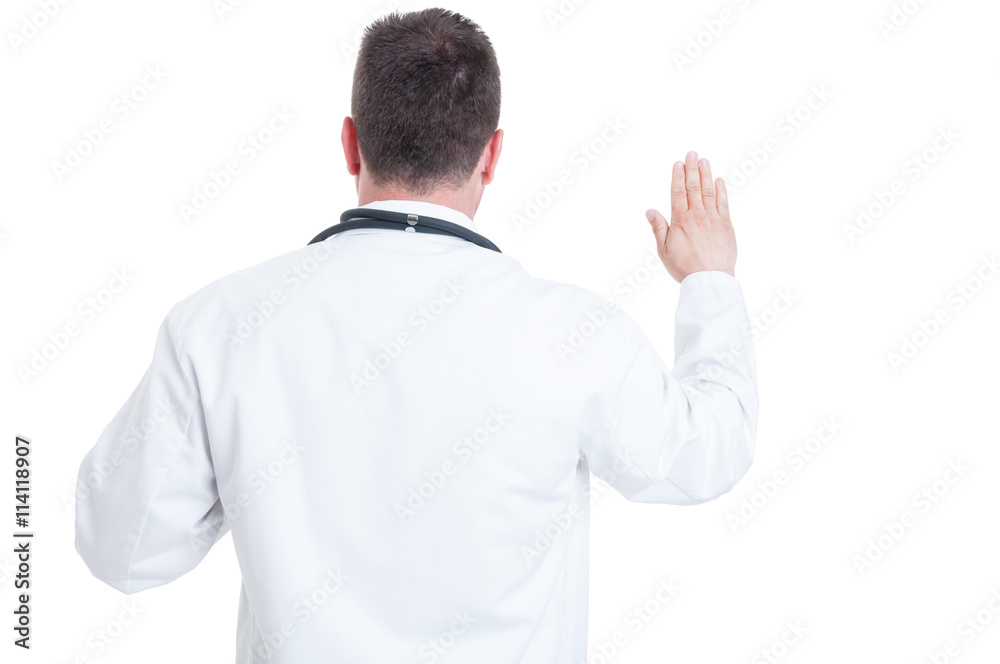 Back view of doctor swearing or having the Hippocratic oath Back view of doctor swearing or having the Hippocratic oath