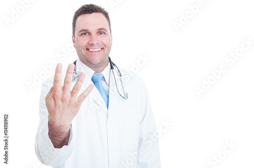 Young doctor smiling and showing number four with one hand