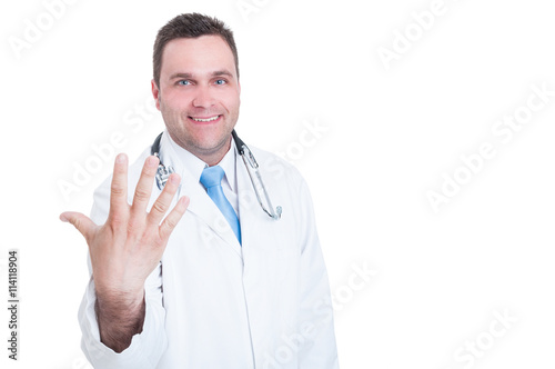 Medic smiling and showing number five with one hand © Catalin Pop