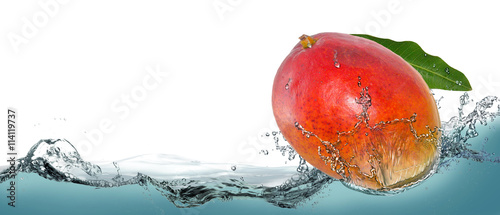 Photos Tropical fruit mango in a spray of water.