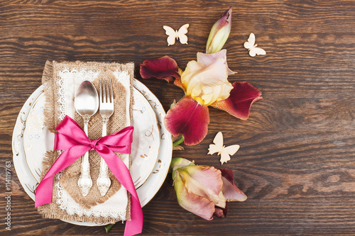 Tableware and silverware with Irises photo