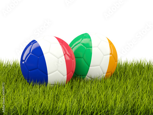 France and Ireland soccer balls on grass