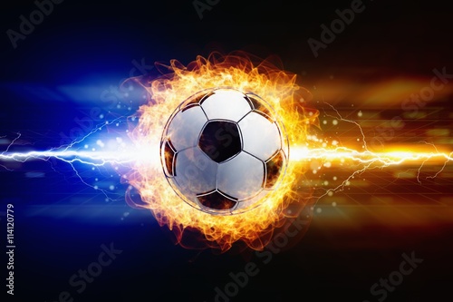 Abstract soccer background - bright powerful lightnings strike burning soccer ball