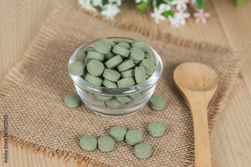 Herbal pill on  bowl. herb for healthy living.