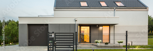 Stylish home with fence photo