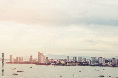 View of Pattaya city from aerial, cityscape in sunrise, vintage tone soft focus © SasinParaksa