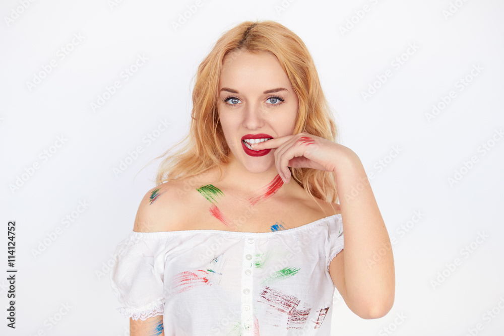 young woman covered herself in many different colors of paint young woman covered herself in many different colors of paint