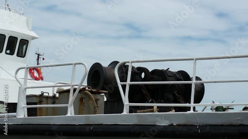 Mooring winches and other constructions on deck of white ship