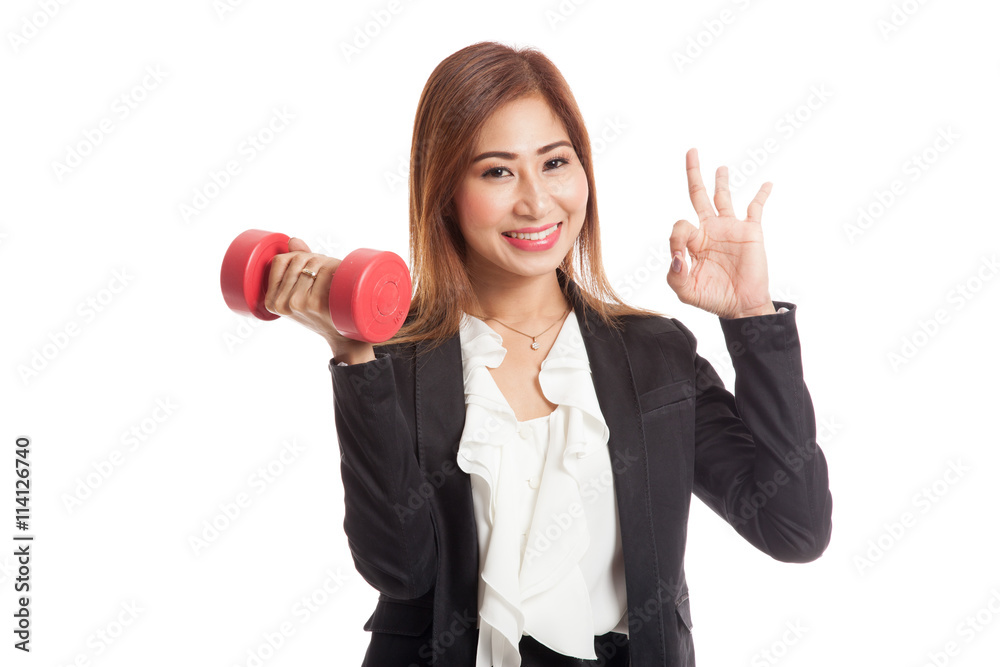 Healthy Asian business woman show OK with dumbbells Healthy Asian business woman show OK with dumbbells