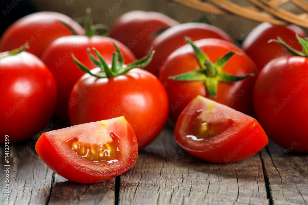 Tomatoes on wooden surface. Selective focus Tomatoes on wooden surface. Selective focus