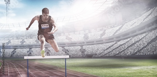 Composite image of sportsman practising hurdles photo