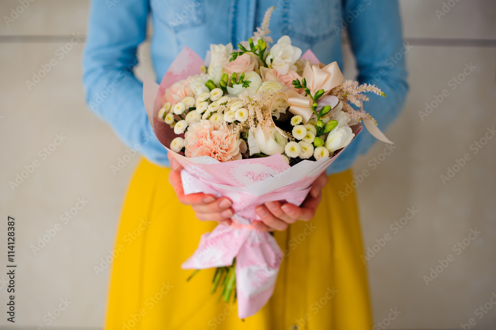 girl holding a bouquet of white flowers Stock Photo | Adobe Stock