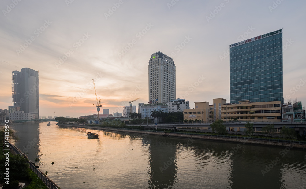 Ho Chi Minh, Vietnam - June 19, 2016: Beautiful sunrise over downtown of Ho Chi Minh City central with Historical Mong Bridge connect traffic between District 1 and District 4.