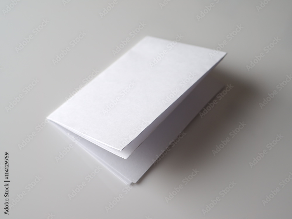 folded paper on a gray background folded paper on a gray background