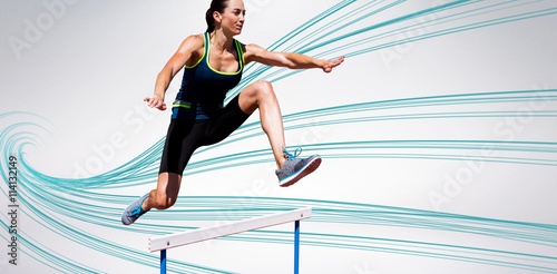 Tableau sur toile Composite image of athletic woman doing show jumping