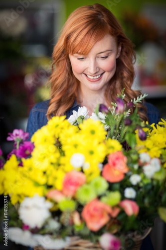 Female florist standing and smiling  © WavebreakMediaMicro
