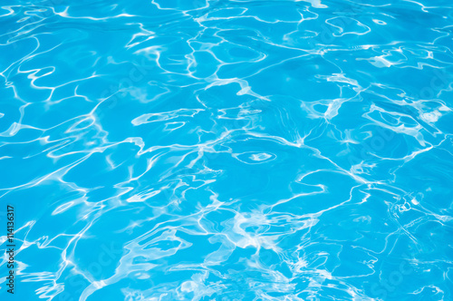 Water in swimming pool, Blue Water surface with sun reflection, Beautiful Blue and Bright ripple water surface