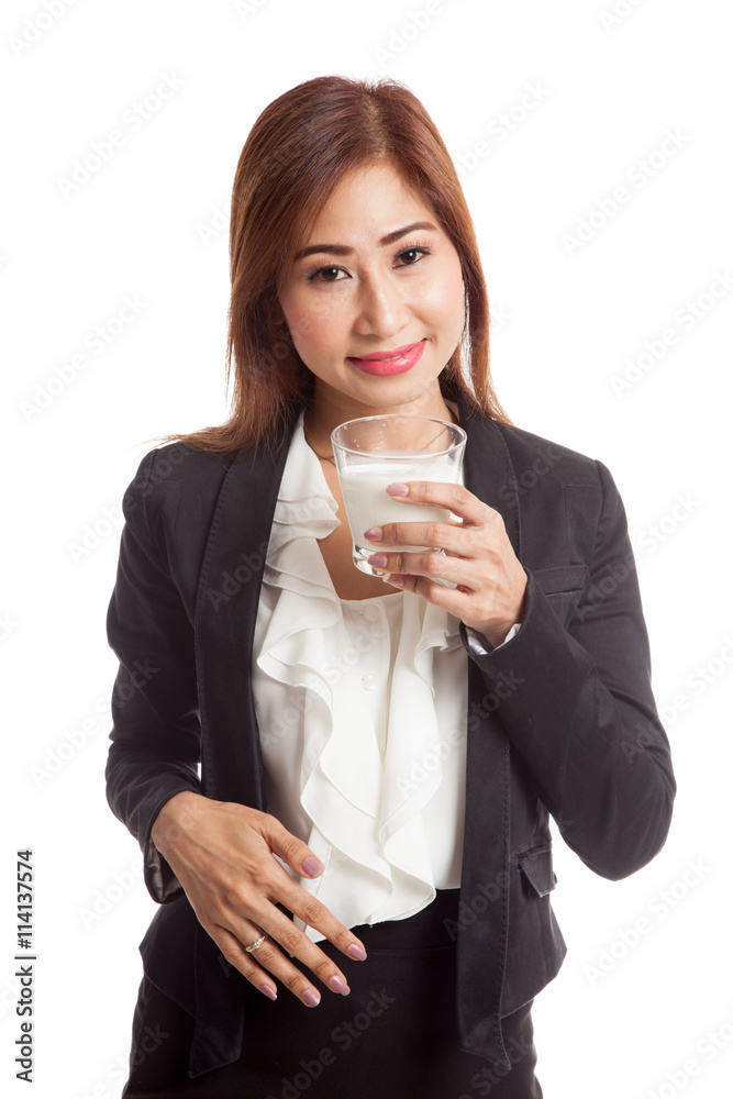 Healthy Asian woman drinking a glass of milk Healthy Asian woman drinking a glass of milk