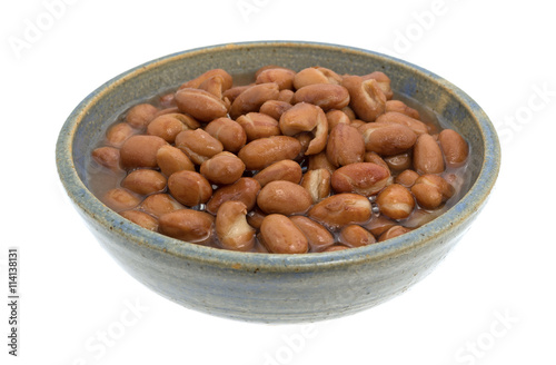 Bowl of shelled beans on a white background.