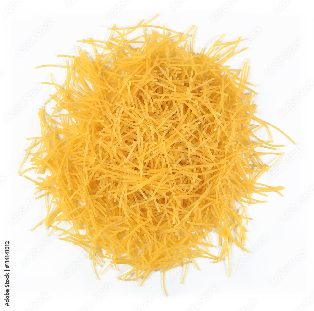 Heap of uncooked italian pasta on a white Heap of uncooked italian pasta on a white