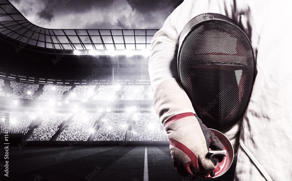 Fotografie Composite image of mid-section of man standing with fencing mask