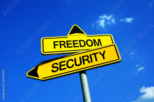 Freedom or Security - Traffic sign with two options - Decision to keep liberty or strong state of monitoring, controlling, intelligence agency, spies, eavesdropping, repressive institution