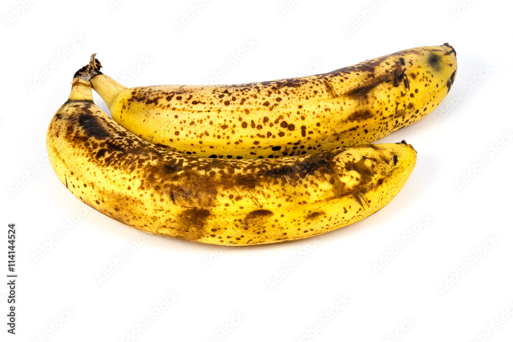 Fotografie Two overripe bananas isolated on white background