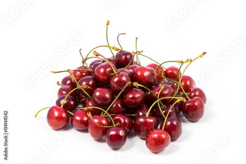 Small heap of ripe sweet cherry isolated on white background