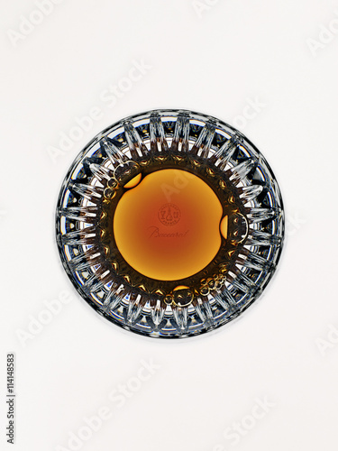 Overhead view of golden alcoholic drink in glass