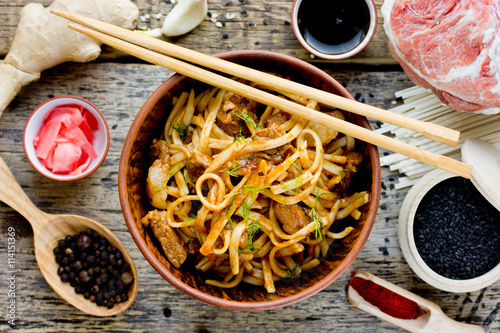 Udon noodles with meat in sauce and ingredients