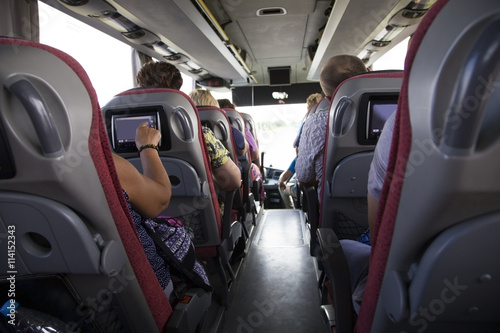 Tourist bus Interior. People go on the tour
