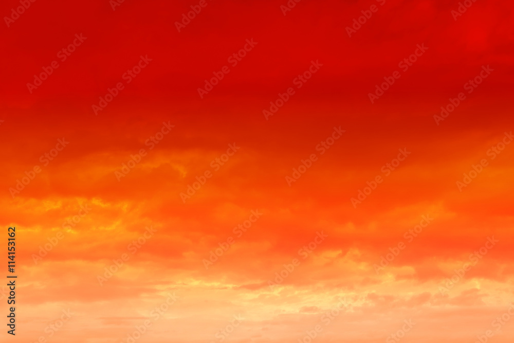 Orange sunset sky with clouds.