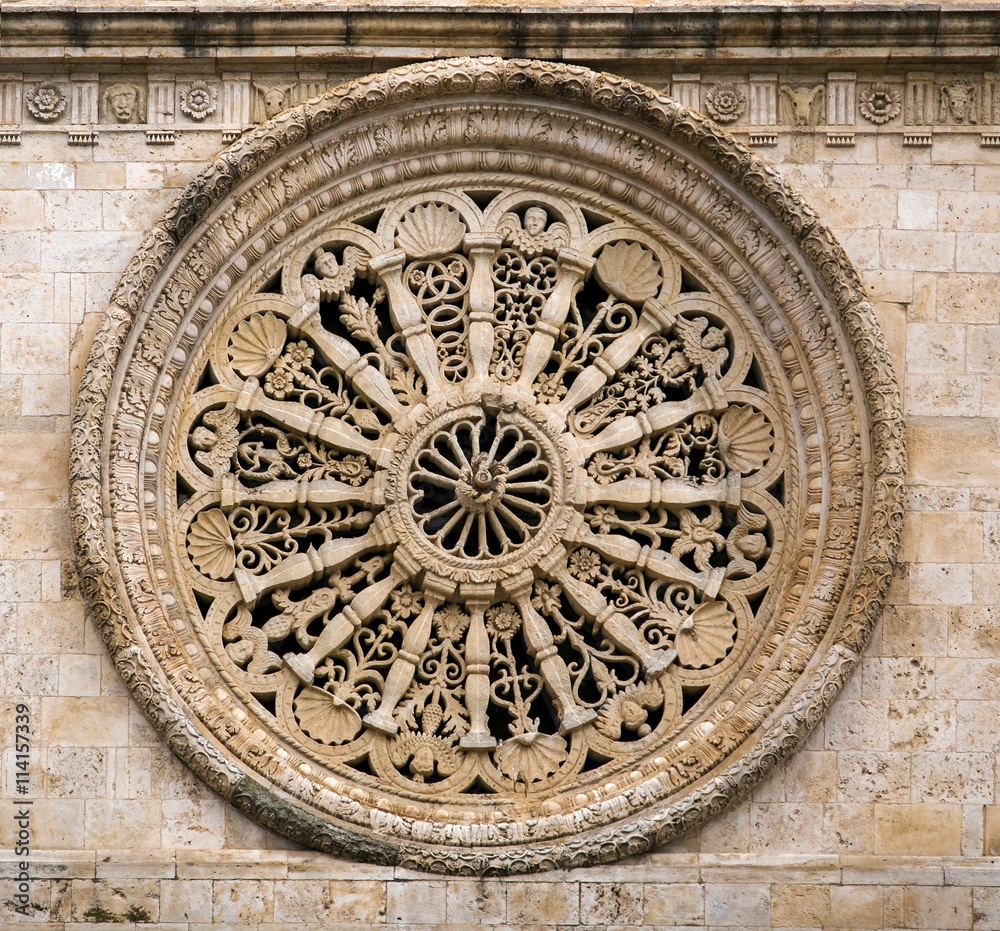 beautiful stone rose window Cathedral of Acquaviva, one of the most beautiful villages in Italy. Puglia - Italy