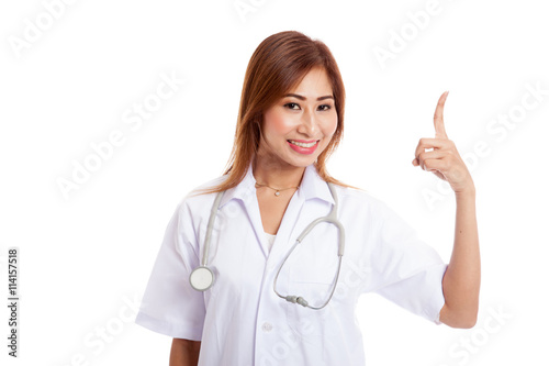 Asian young female doctor point up